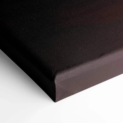 Back of minimalist sunrise mountain canvas with black textured surface and brown edge