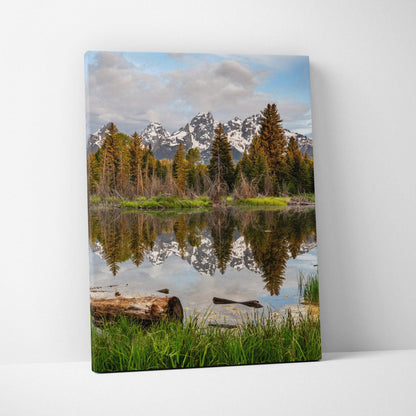 Mountain landscape canvas wall art with snow-capped peaks and reflective lake scene.
