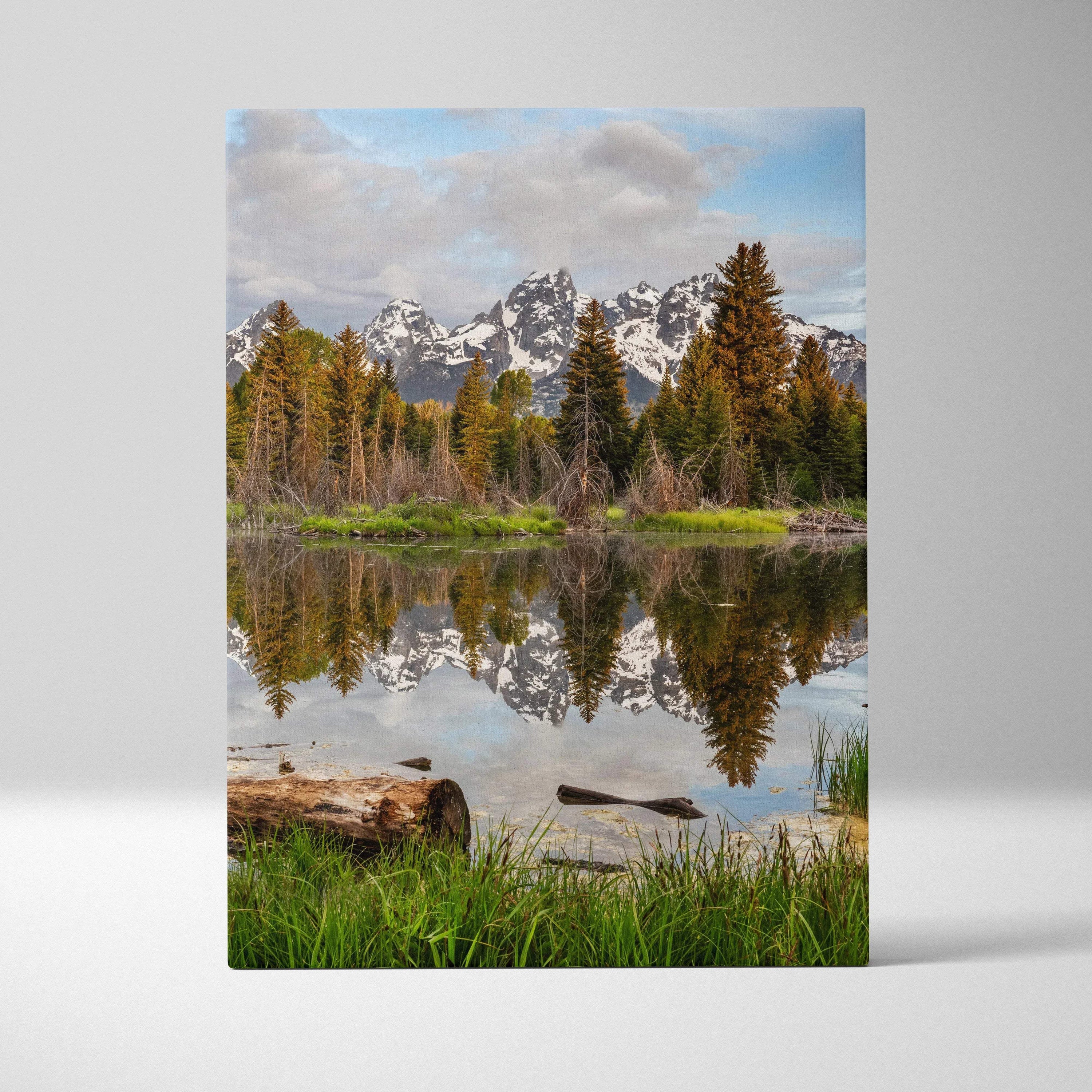 Canvas wall art featuring snow-capped mountains reflected in a calm lake with autumn trees.
