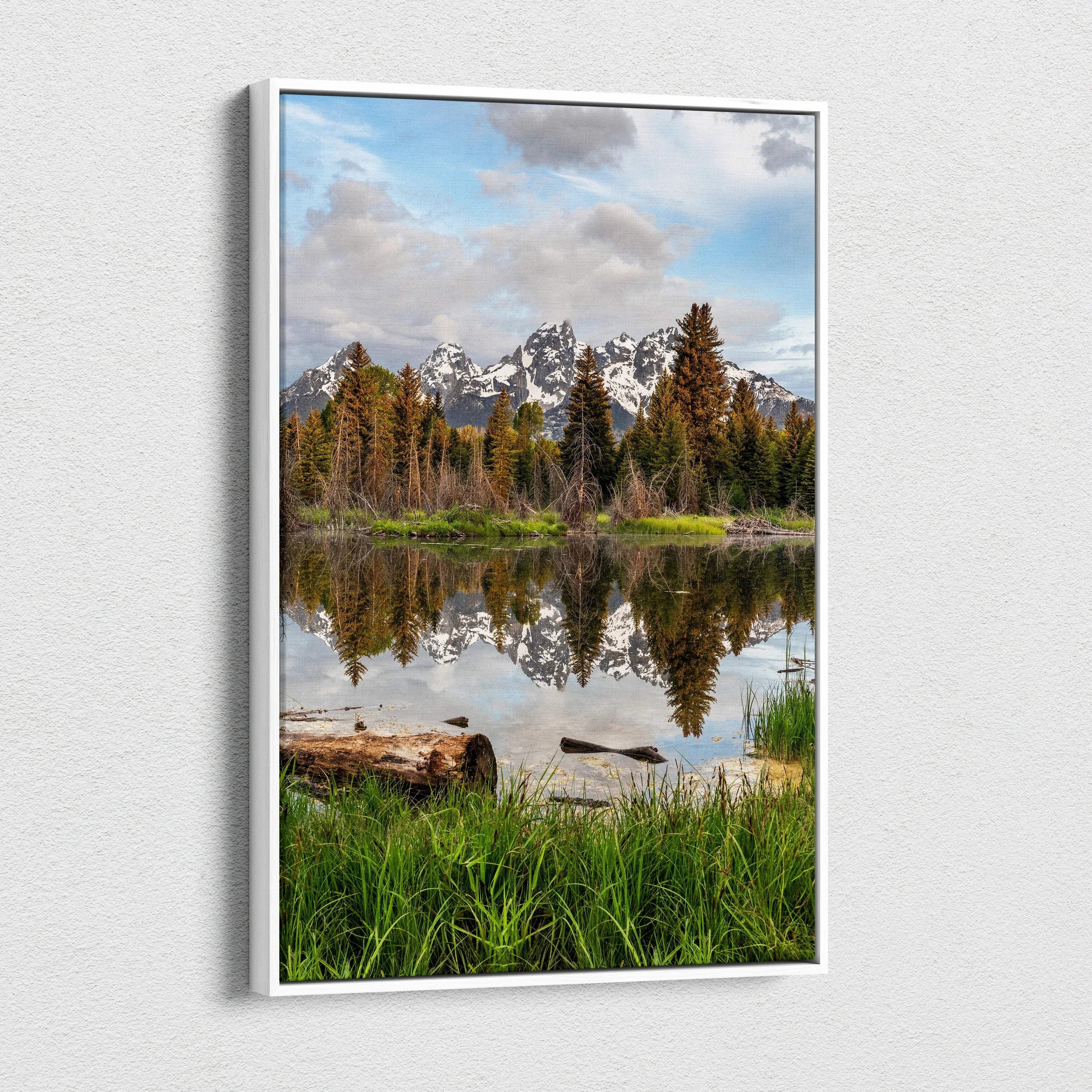 Vertical canvas wall art featuring a majestic mountain landscape with pine trees and lake reflection.