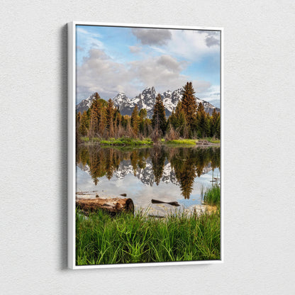 Vertical canvas wall art featuring a majestic mountain landscape with pine trees and lake reflection.