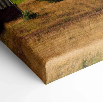 Close-up of canvas wall art corner with textured brushstrokes in warm earthy tones.