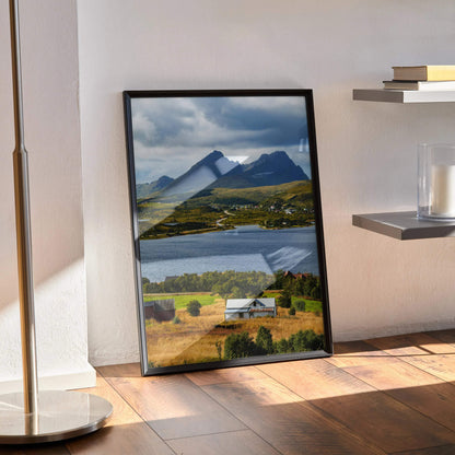 Majestic mountain landscape poster with river and green fields in black frame wall art.