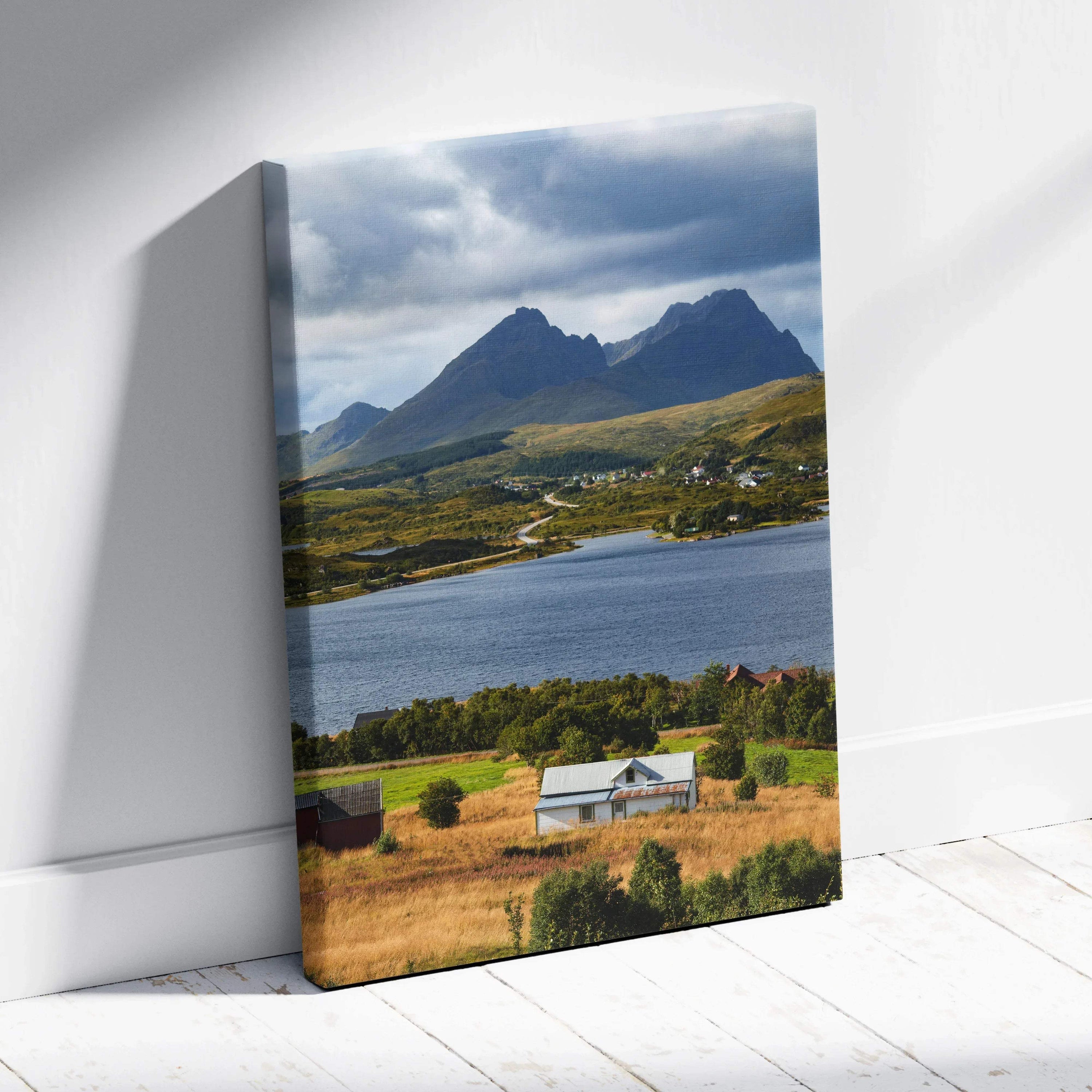 Vertical canvas wall art featuring majestic mountains, lake, and rural countryside scene.