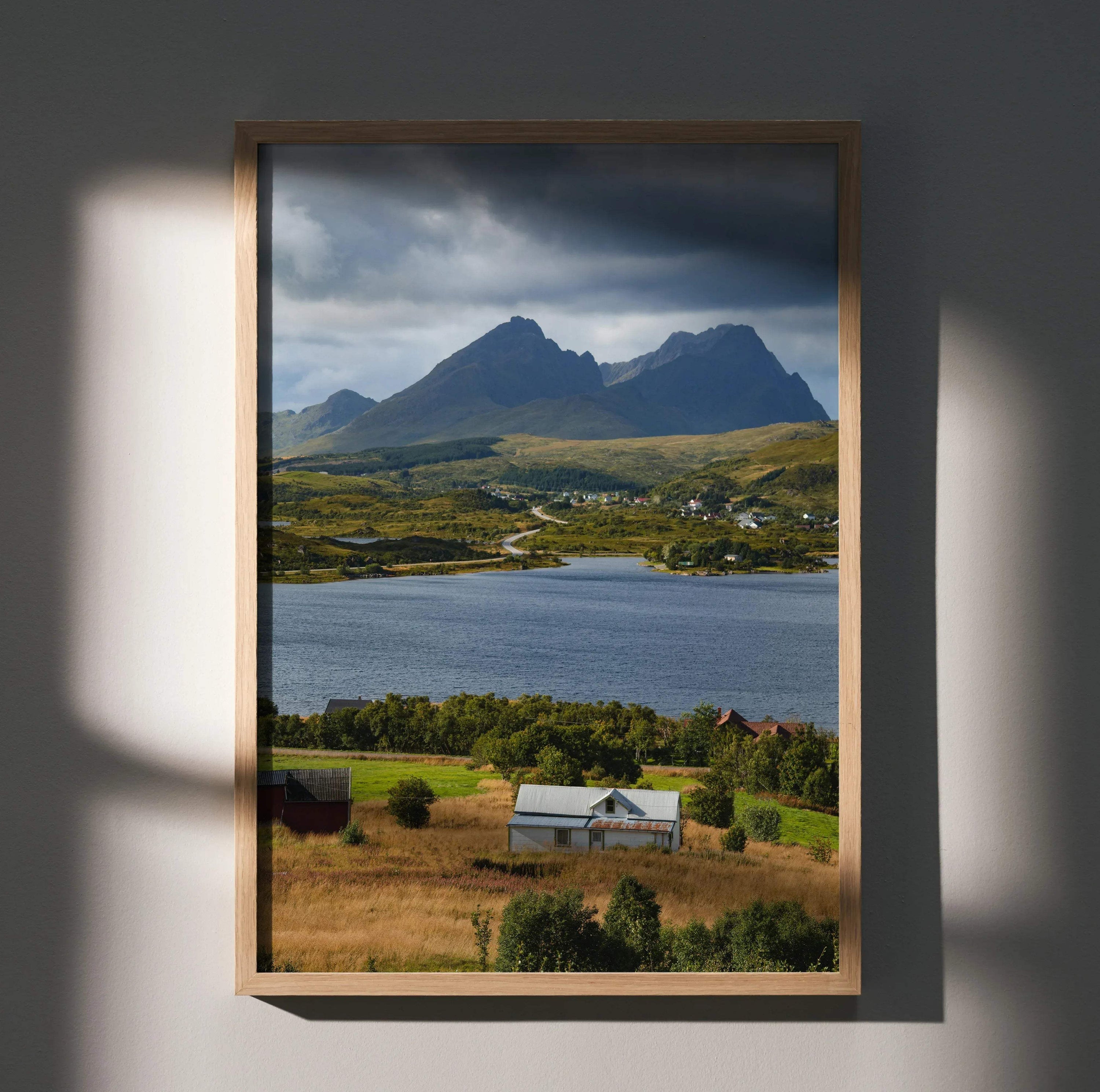 Vertical mountain landscape poster with dramatic clouds over lake and rural farmhouse, wall art print.