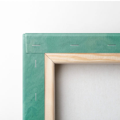 Aerial turquoise ocean canvas wall art print featuring teal canvas wrapped around a light wood frame for coastal decor