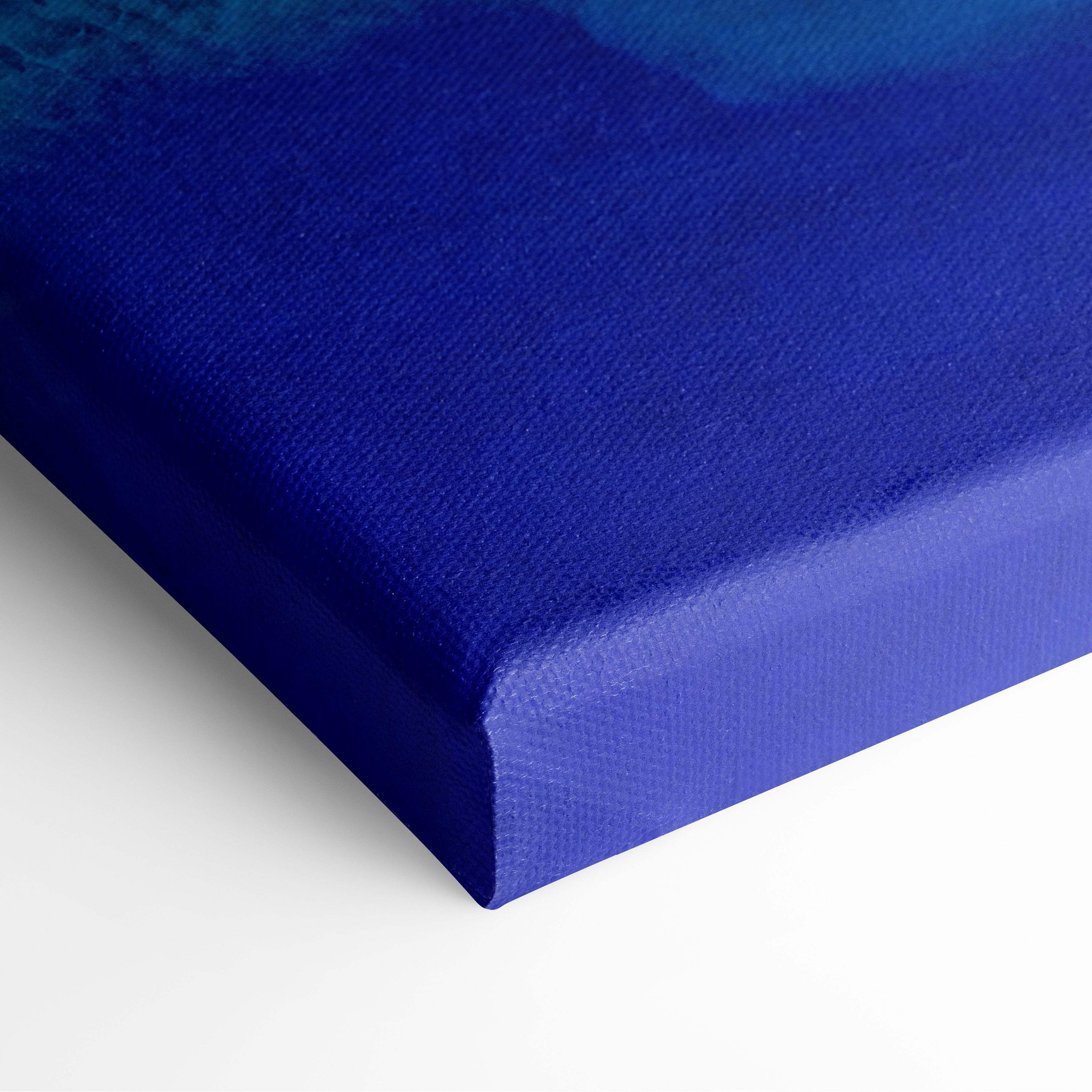 Deep blue aerial turquoise ocean canvas wall art print with textured woven surface for coastal living room decor