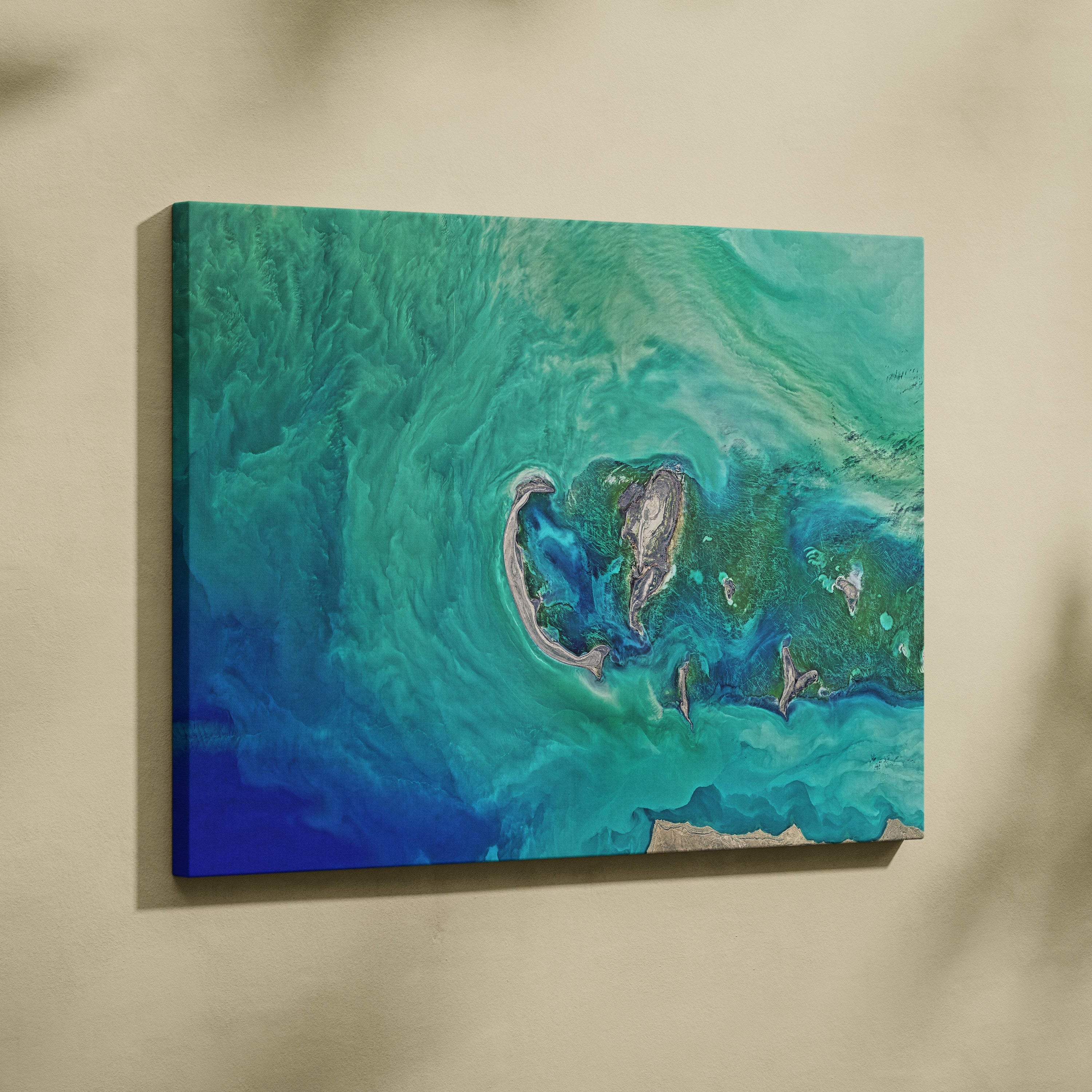 Vibrant abstract turquoise and blue canvas wall art print depicting a stylized tropical island reef for coastal decor