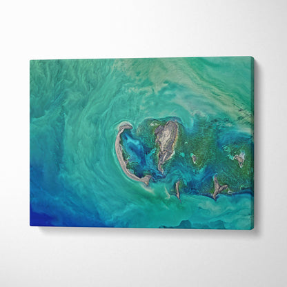 Aerial turquoise ocean canvas wall art print with abstract swirling ocean scene in vibrant blue green tones for coastal decor
