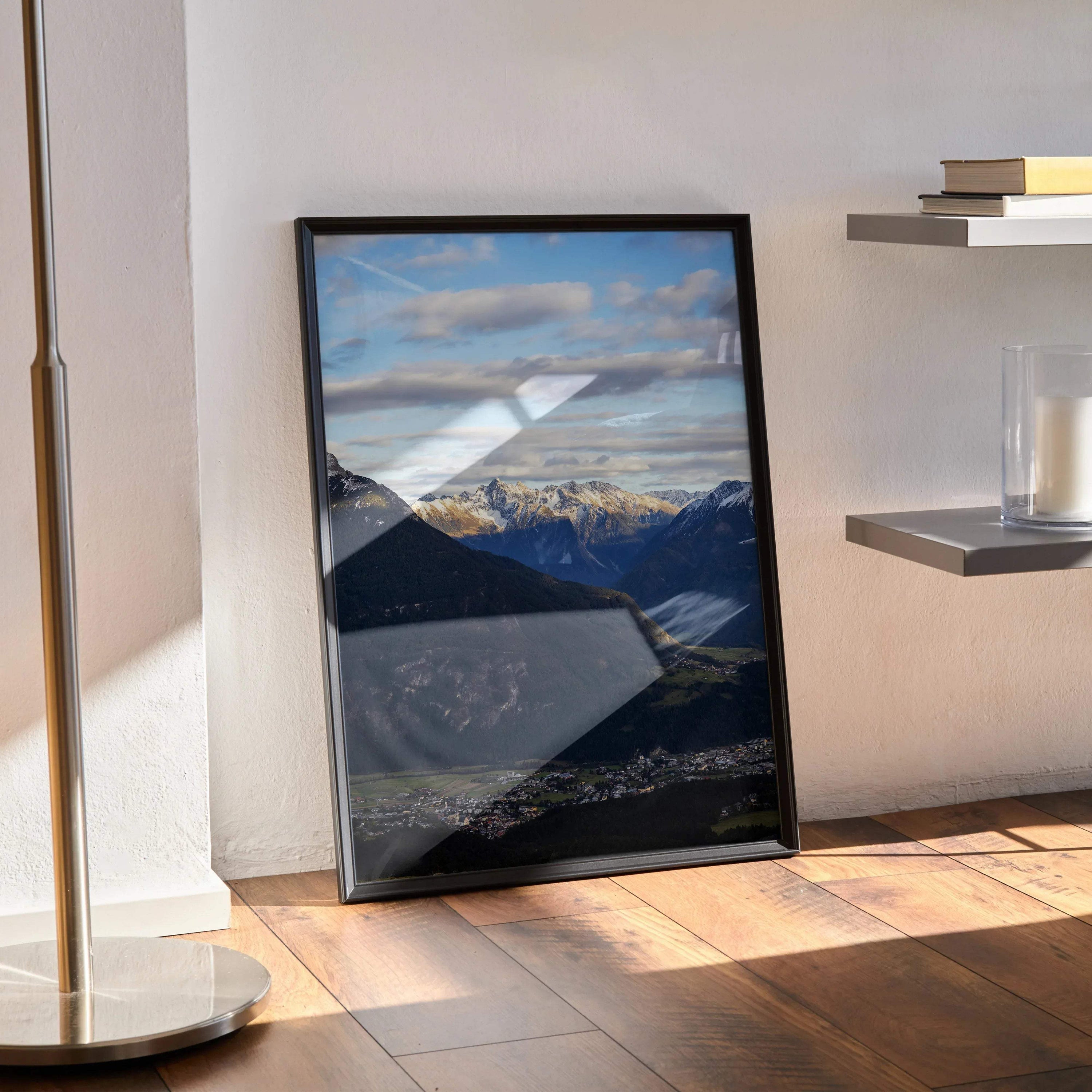 Majestic mountain landscape poster with blue sky, clouds, and snowy peaks in black frame wall art.
