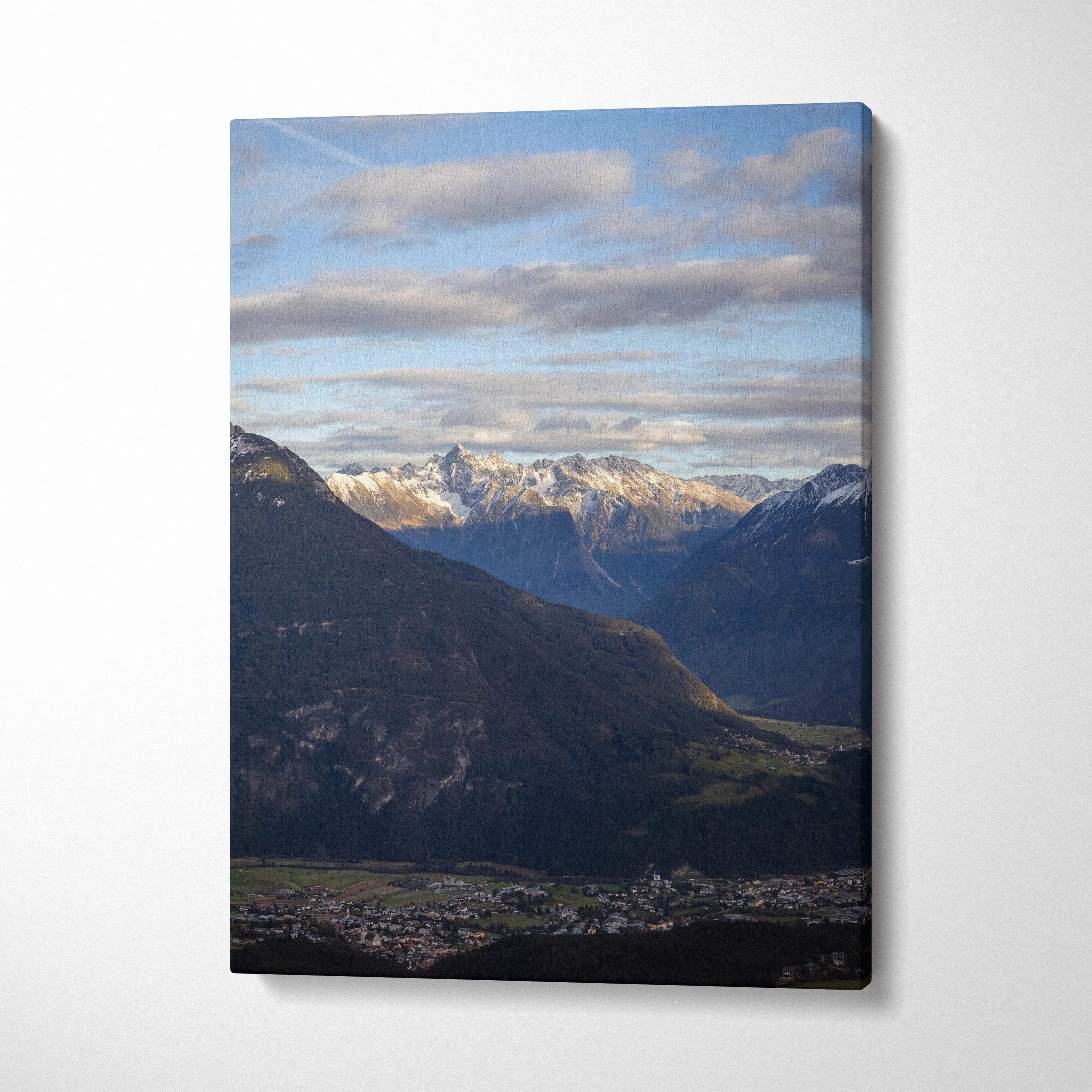 Vertical canvas wall art featuring a majestic mountain landscape under a cloudy sky.