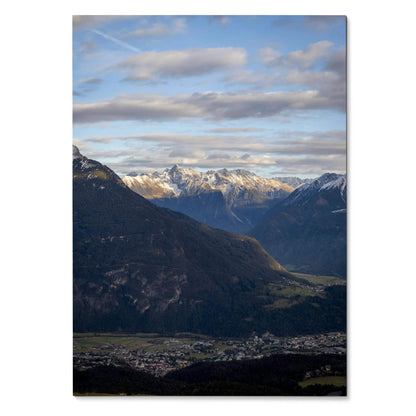 Majestic mountain landscape with snow-capped peaks under a cloudy blue sky poster wall art.
