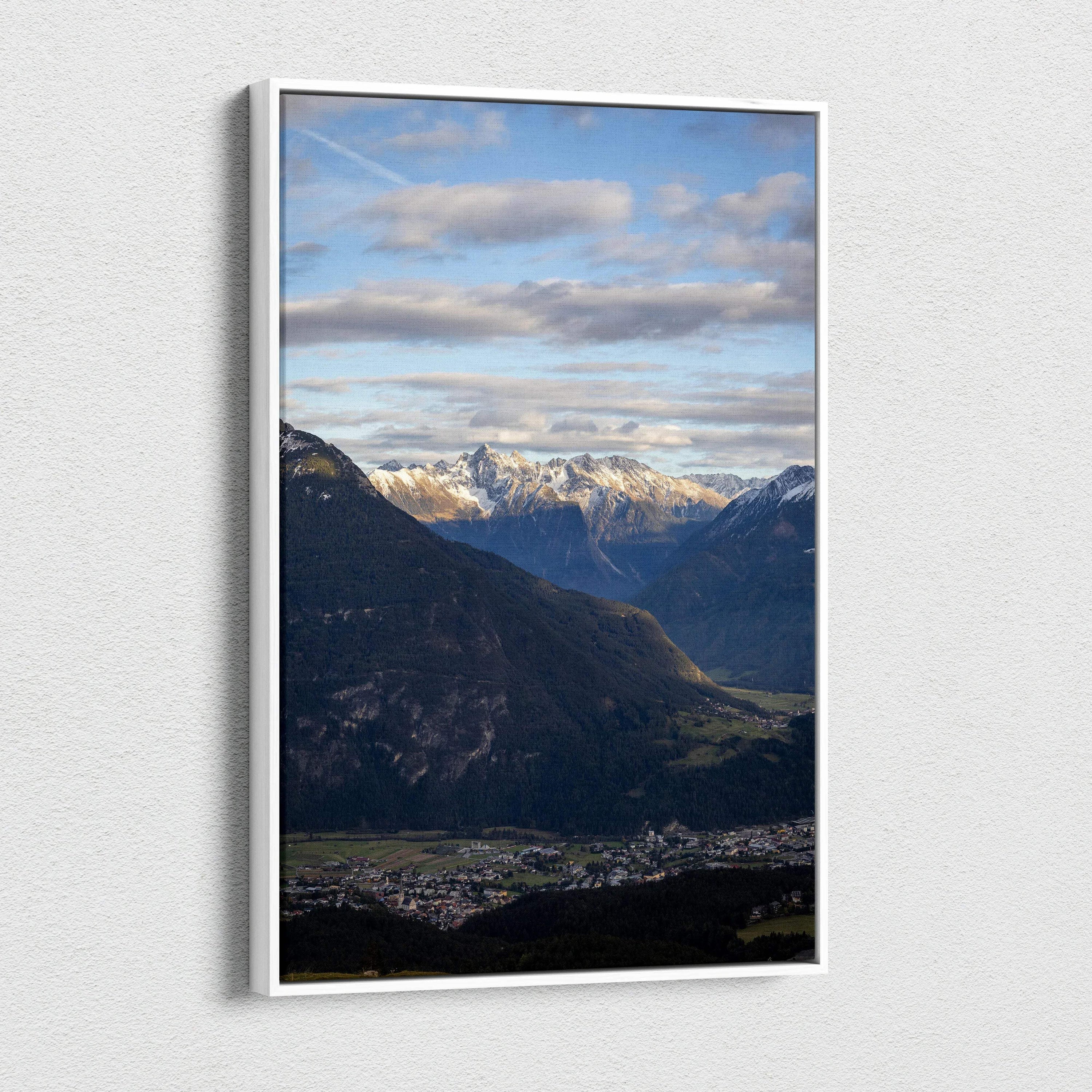Vertical canvas wall art featuring a majestic mountain landscape under a cloudy sky.
