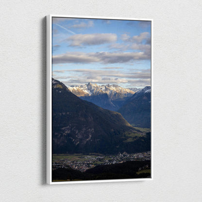 Vertical canvas wall art featuring a majestic mountain landscape under a cloudy sky.