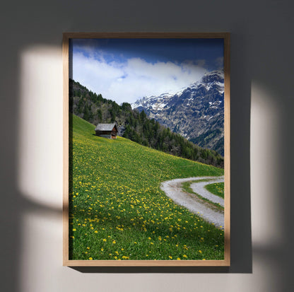 Vertical poster wall art featuring a winding path through a yellow wildflower meadow with forest and snow-capped mountains.