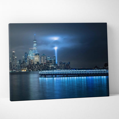 Blue-lit NYC skyline canvas with One World Trade Center and memorial beam