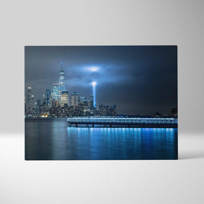 Cinematic New York City nighttime skyline canvas with memorial light beam in cool blues