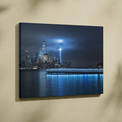Blue-lit NYC skyline canvas with One World Trade Center and memorial light beam