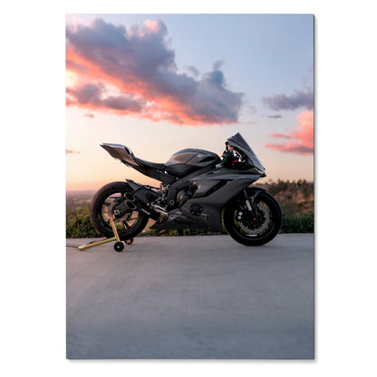 Yamaha R6 motorcycle against sunset sky poster wall art with sleek black bike silhouette.