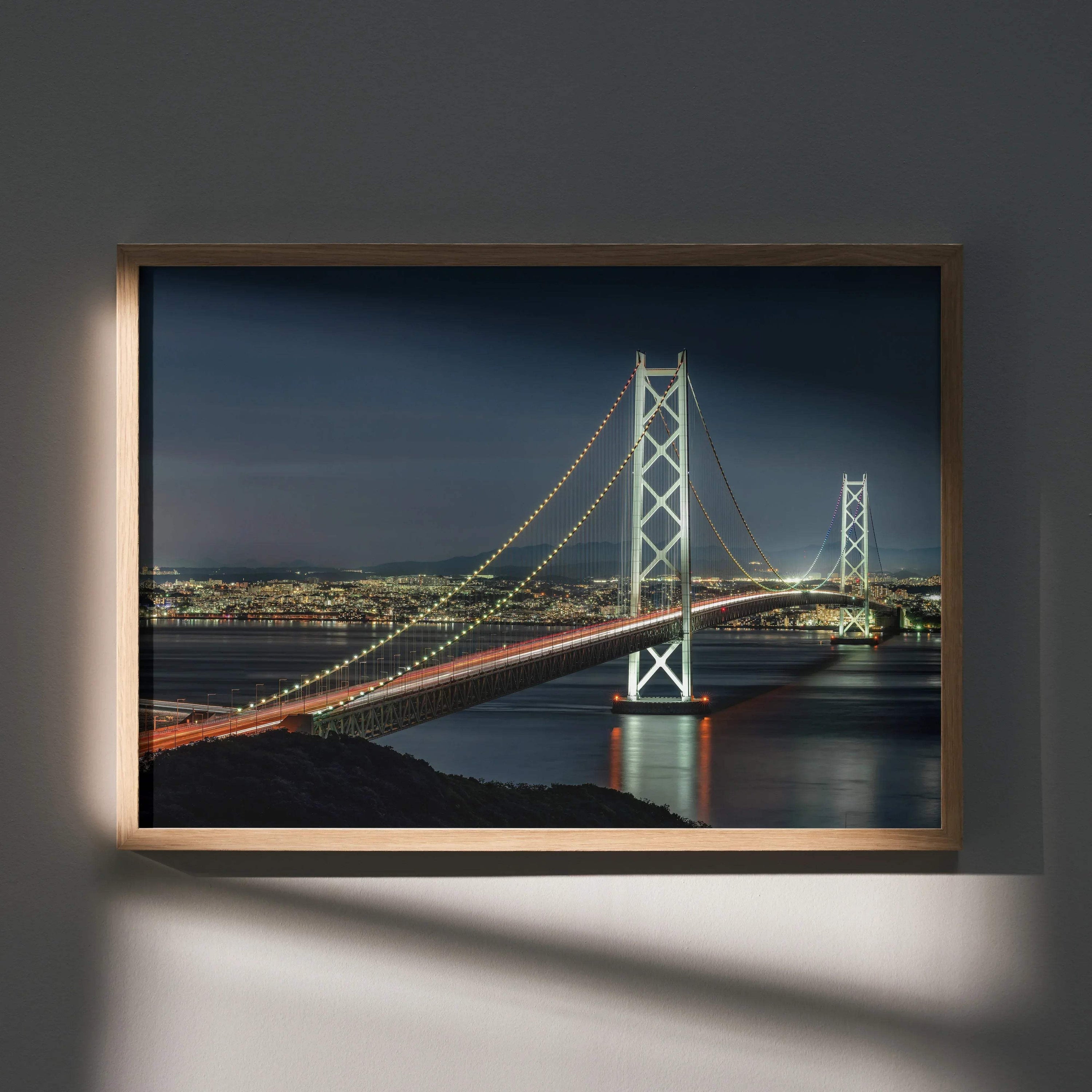 Vibrant city night skyline poster featuring illuminated suspension bridge over water, modern wall art in wooden frame.
