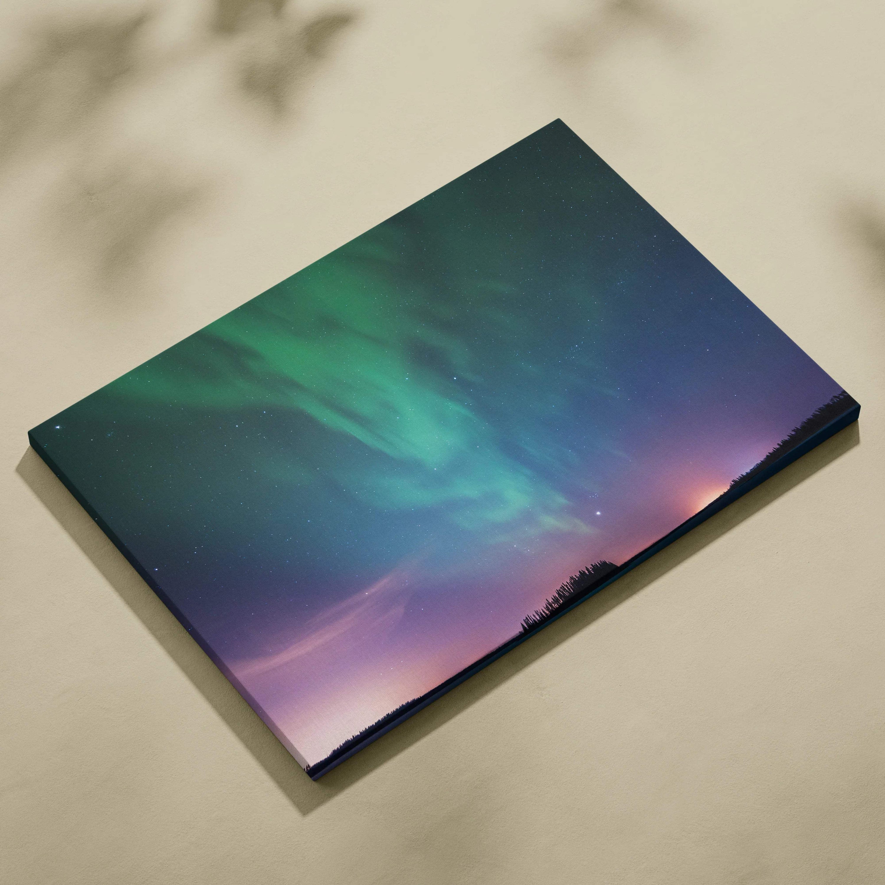 Northern lights over calm lake and forest silhouette canvas wall art