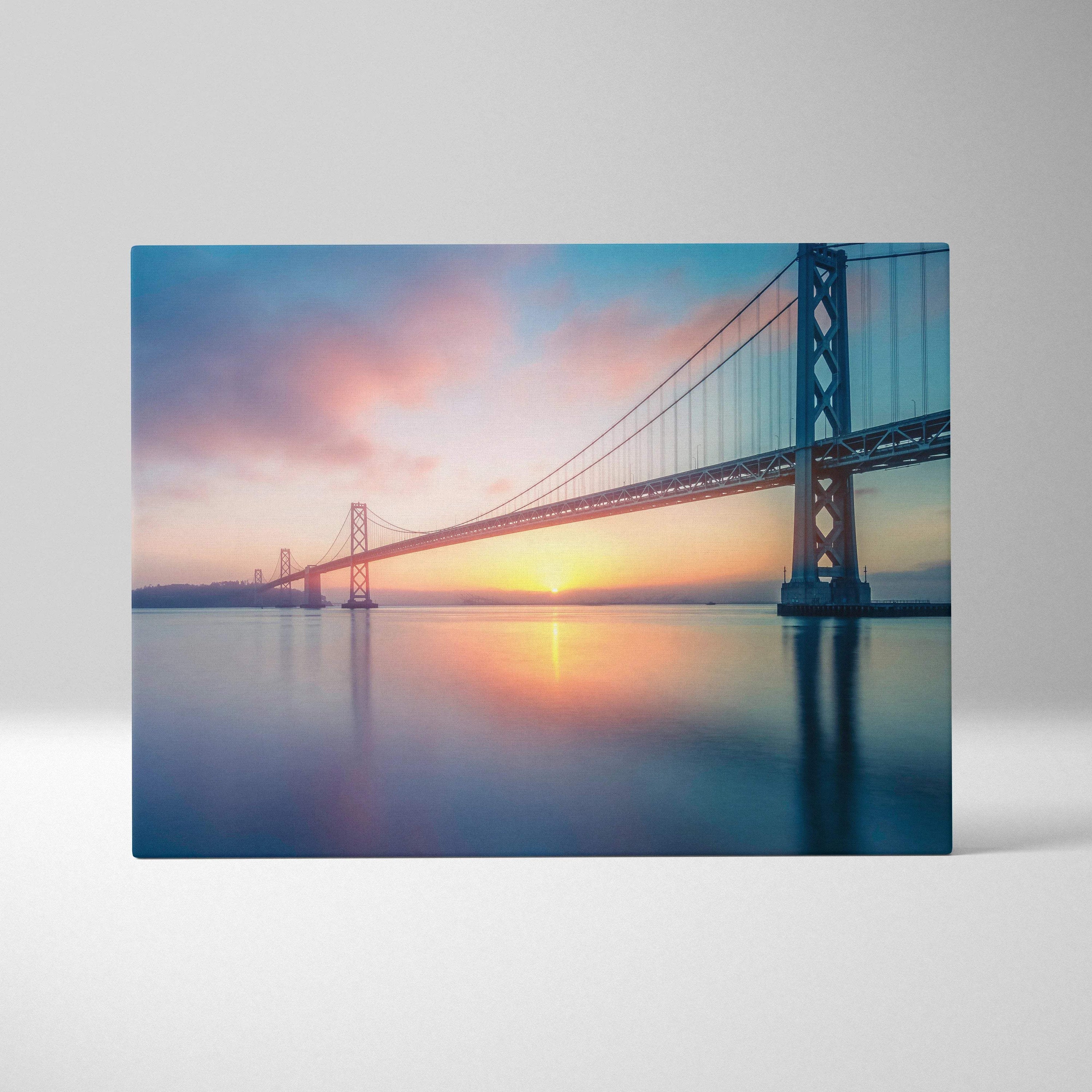Cinematic Bay Area Bridge sunrise canvas wall art in soft blues golds pinks