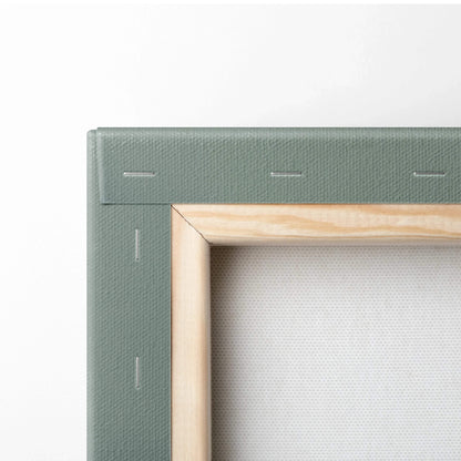 Close-up of wooden stretcher frame with canvas fabric and staples for wall art print.