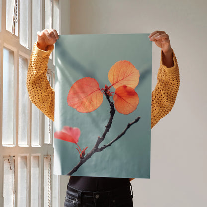 Vibrant autumn leaves on a branch against a muted blue background poster wall art.