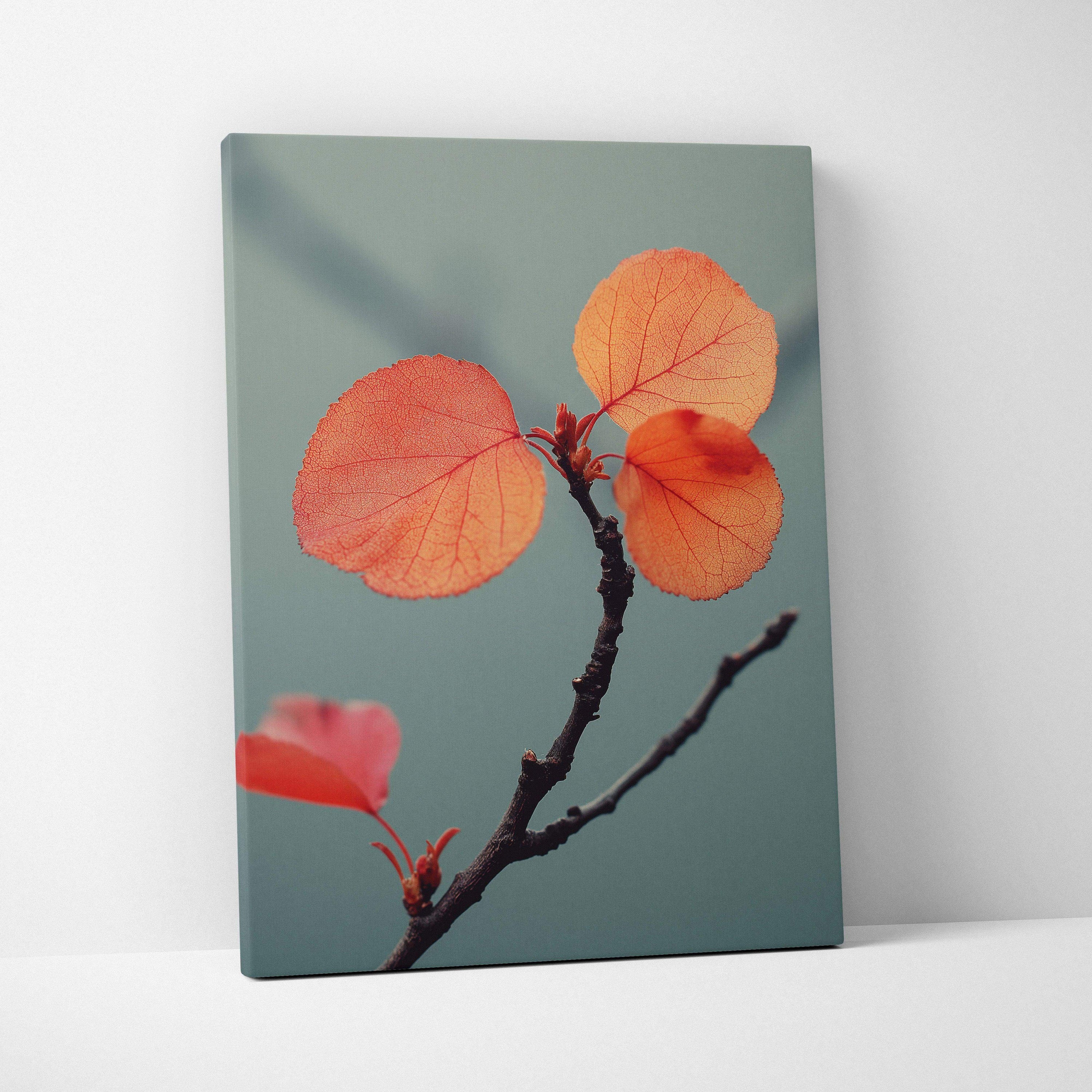 Canvas wall art featuring close-up of vibrant orange autumn leaves on a branch against muted blue-gray background.