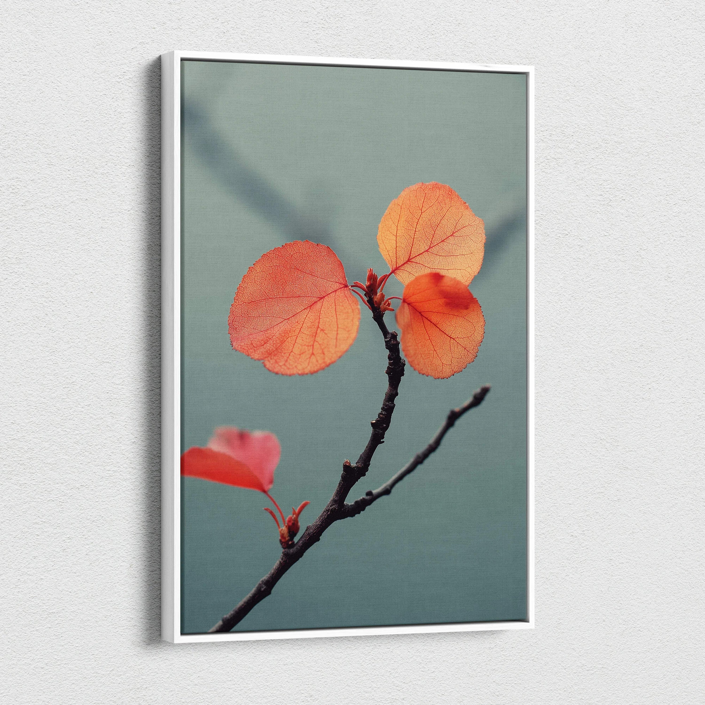 Canvas wall art featuring a close-up of orange autumn leaves on a dark branch against a muted blue background.