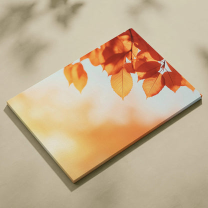 Autumn leaves in warm orange tones on canvas wall art with soft blurred background.