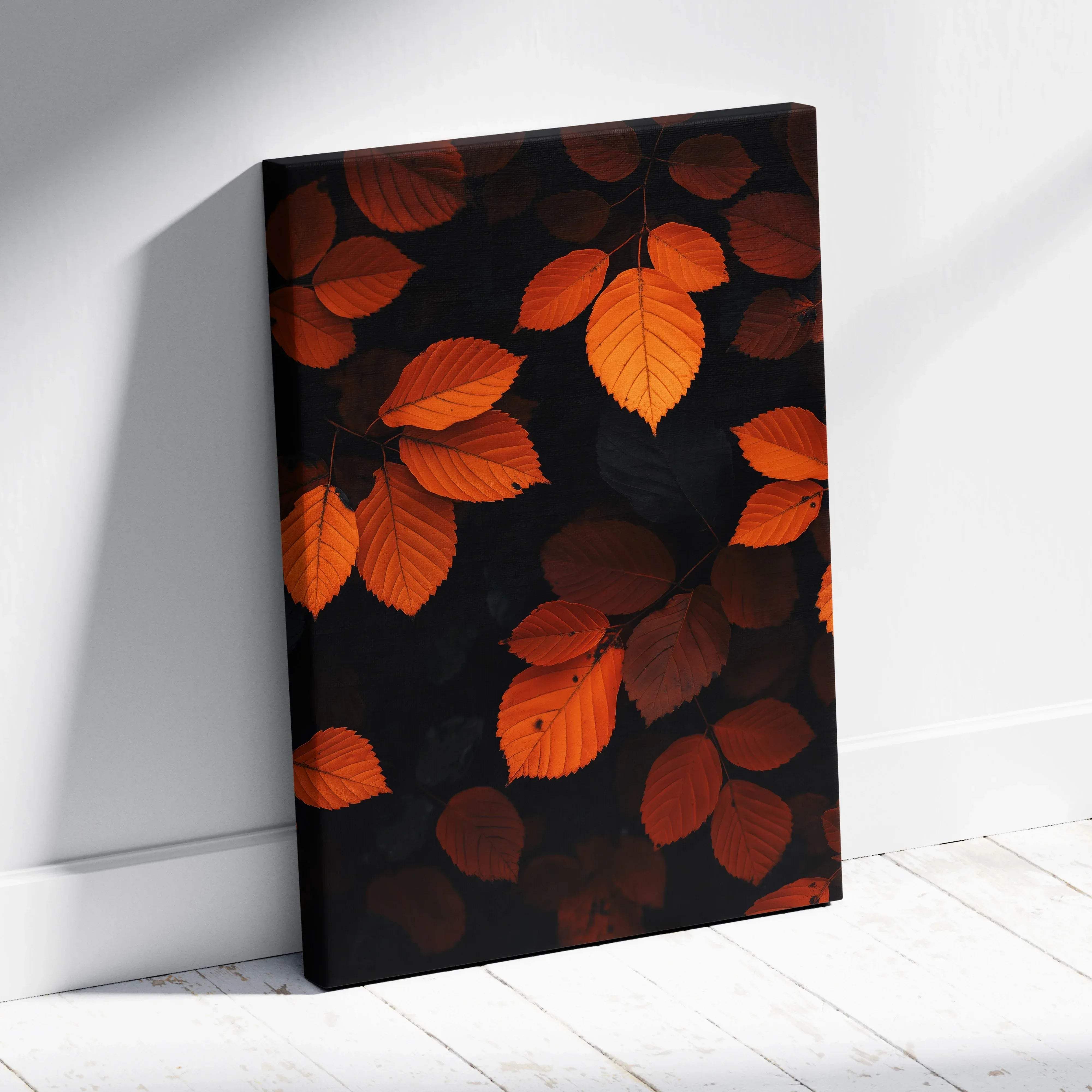 A rectangular canvas print featuring vibrant orange and rust autumn leaves on a deep black backdrop