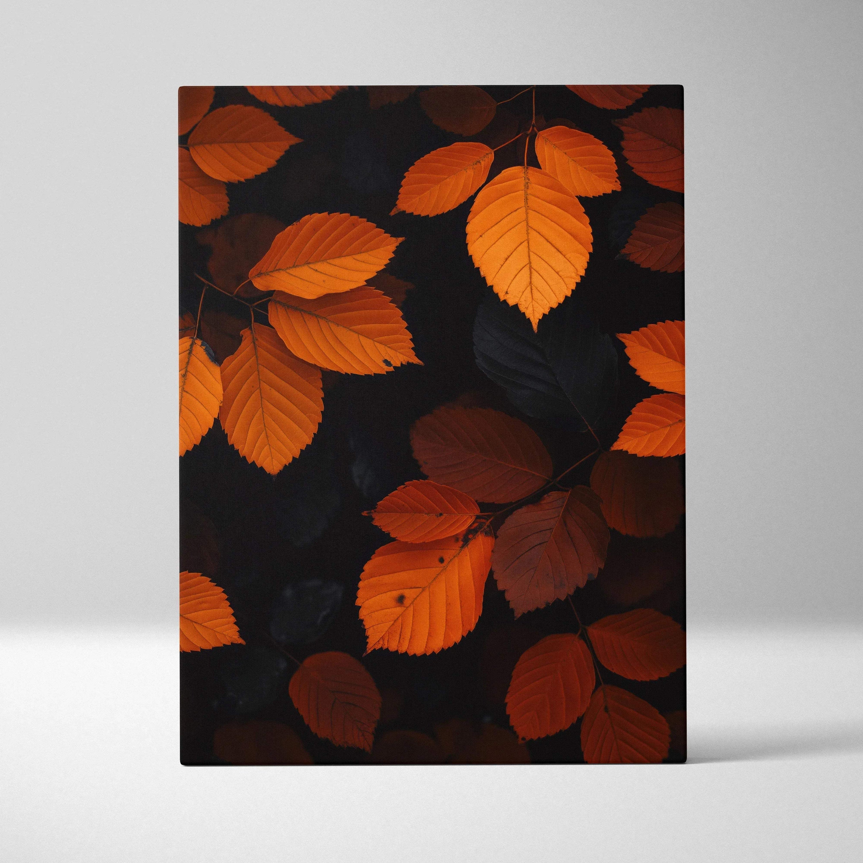 Vertical canvas wall art featuring vibrant orange autumn leaves against a dark background.
