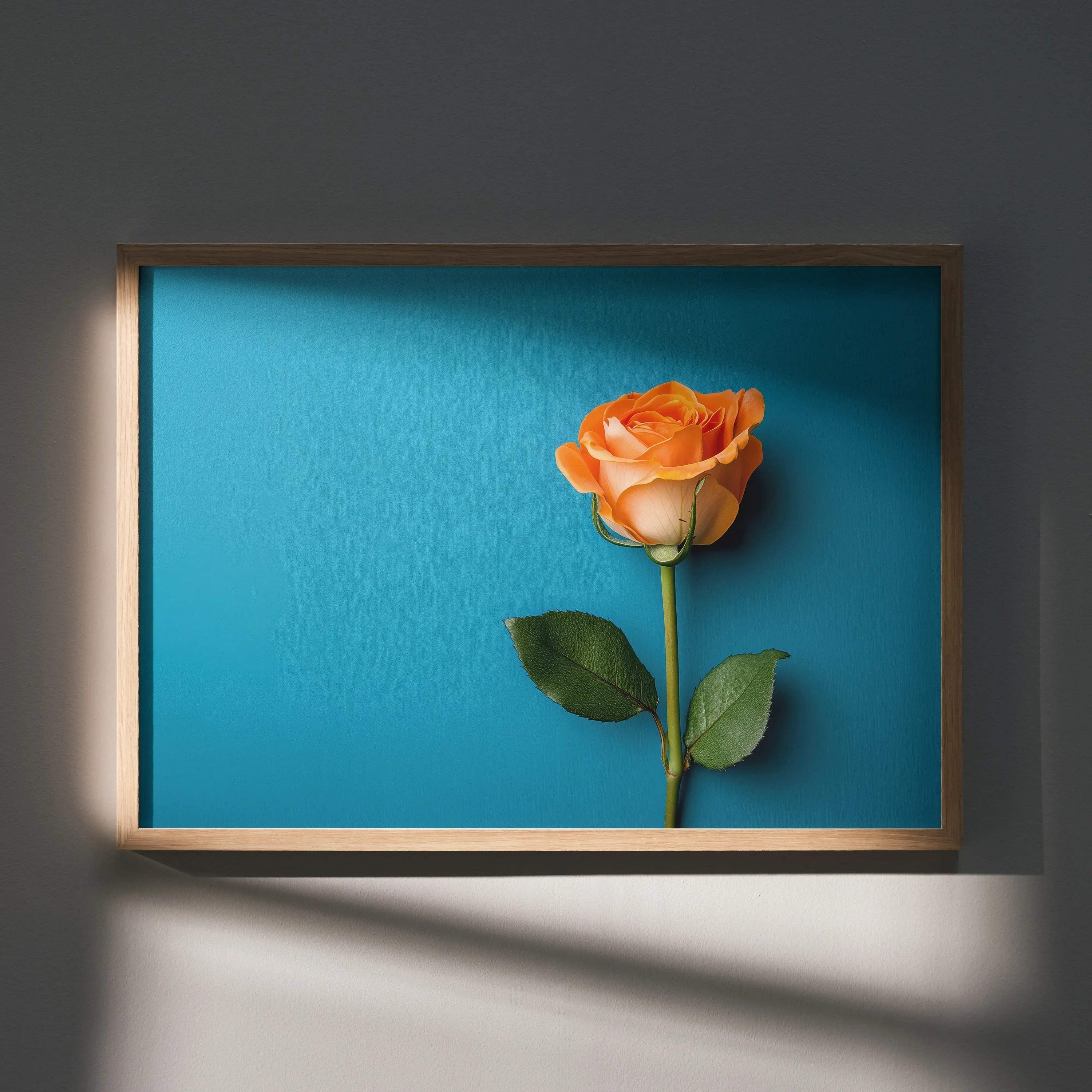 Vibrant orange rose floral art poster with green leaves on bright blue background wall art.