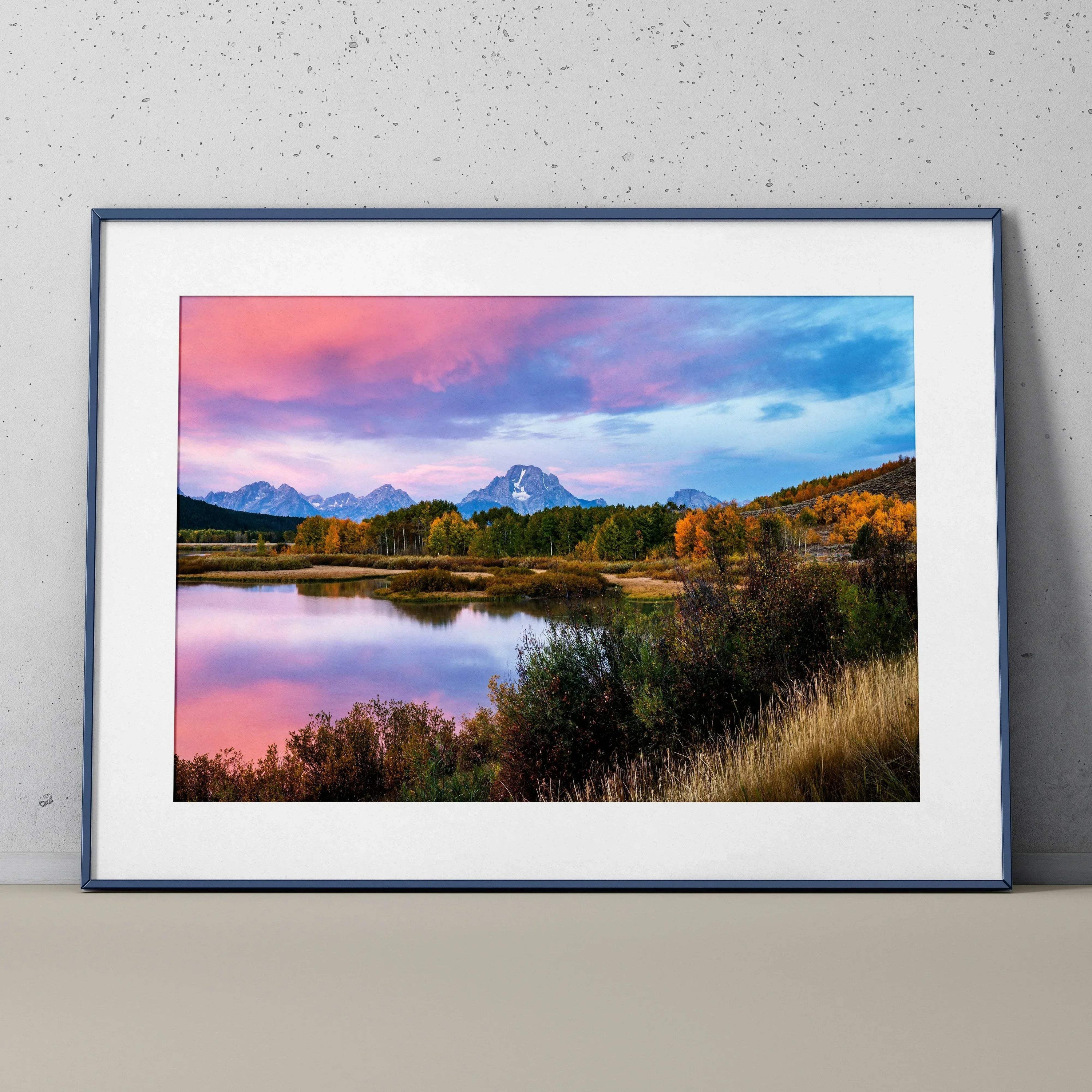 Mountain sunset poster wall art with vibrant pink and blue sky reflecting on lake.