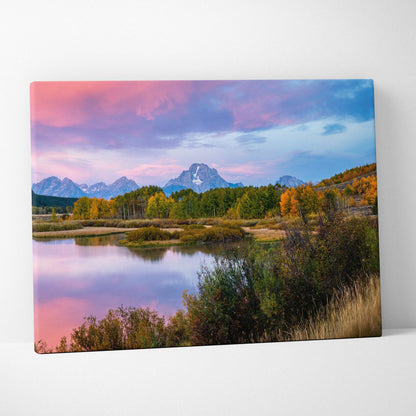 Canvas wall art featuring a colorful mountain sunset reflecting over a calm lake with autumn trees.
