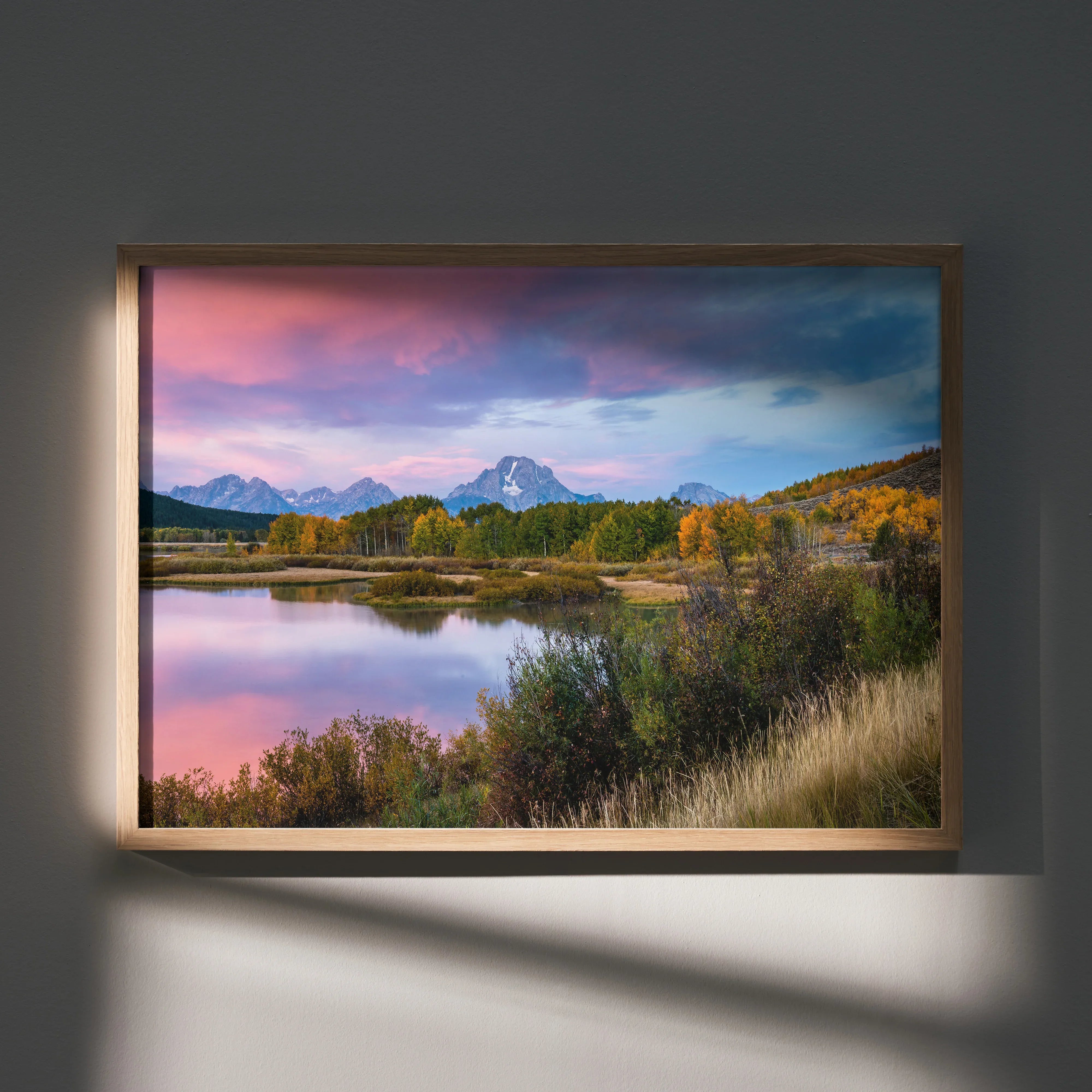 Mountain sunset poster with vibrant pink and purple sky over lake and forest wall art.