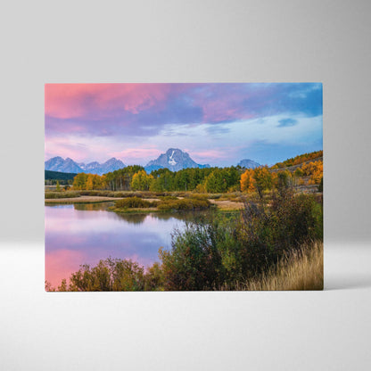 Canvas wall art featuring a vibrant sunset over majestic mountains with reflective water and autumn trees.