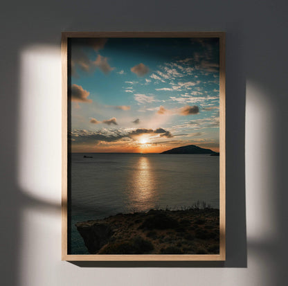 Vertical poster of vibrant ocean sunset with clouds over calm water, framed wall art.