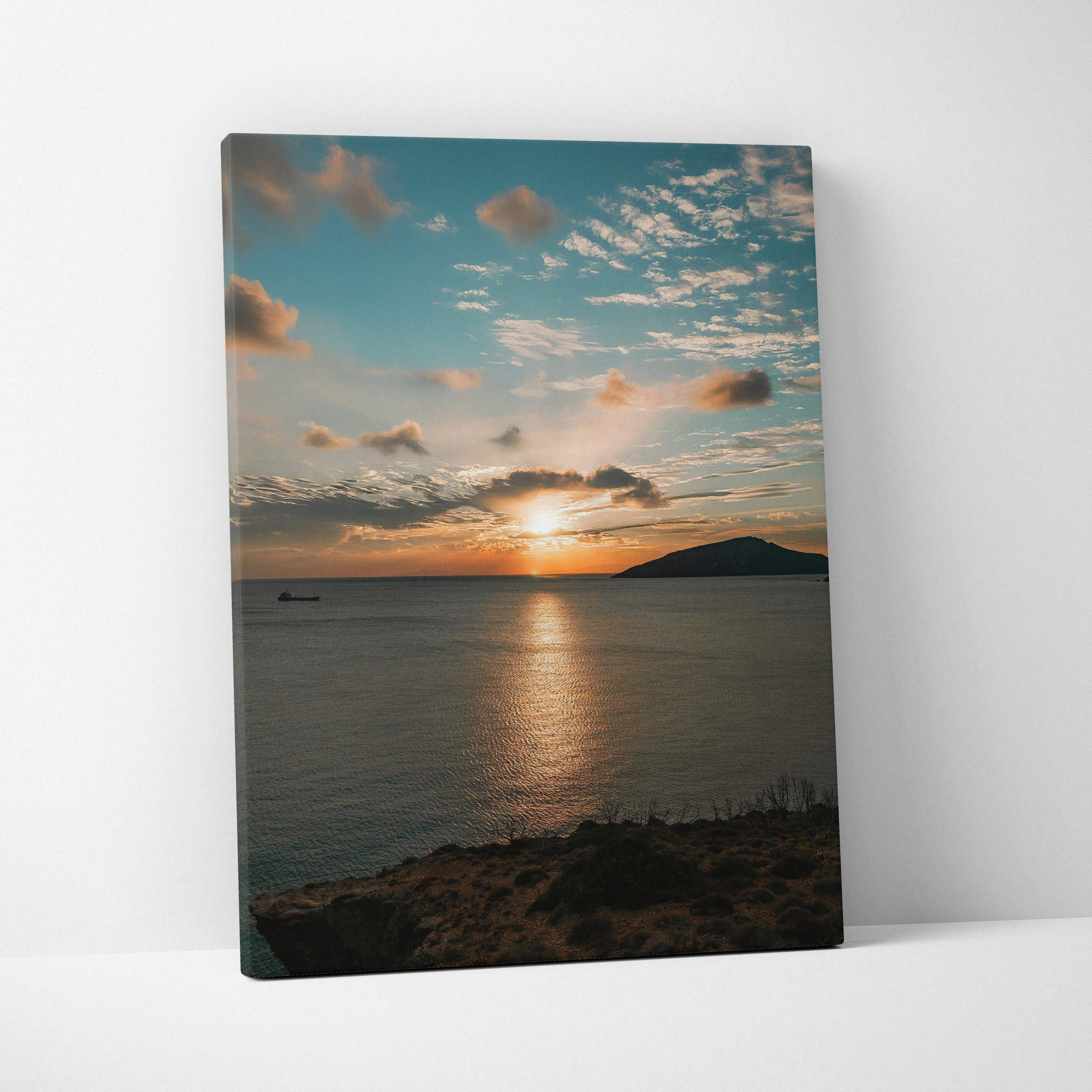 Canvas wall art featuring a vibrant ocean sunset with dramatic clouds over calm water.