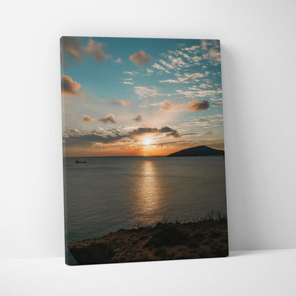 Canvas wall art featuring a vibrant ocean sunset with dramatic clouds over calm water.