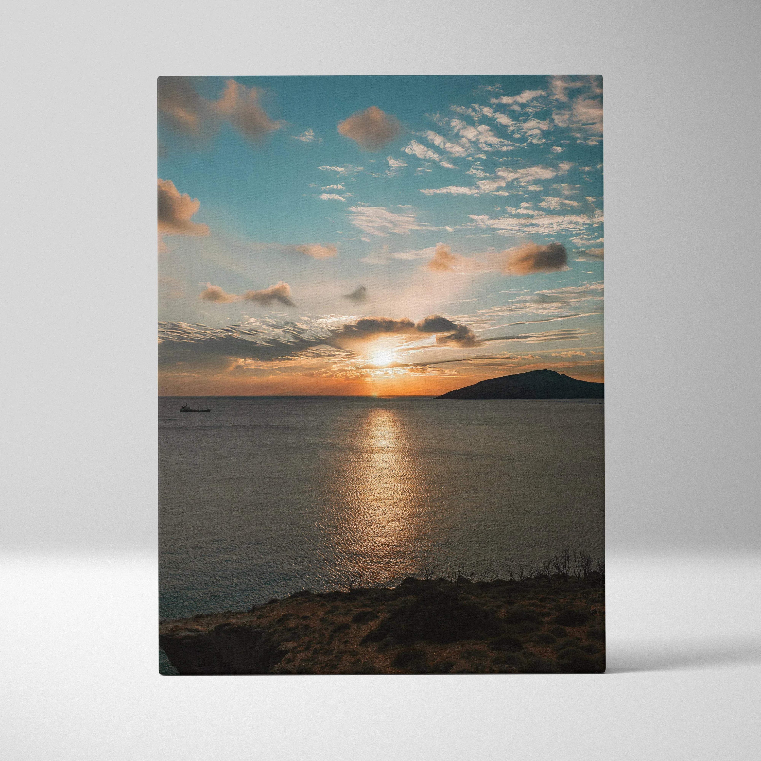 Canvas wall art featuring a vibrant ocean sunset with clouds and a glowing horizon over calm water.
