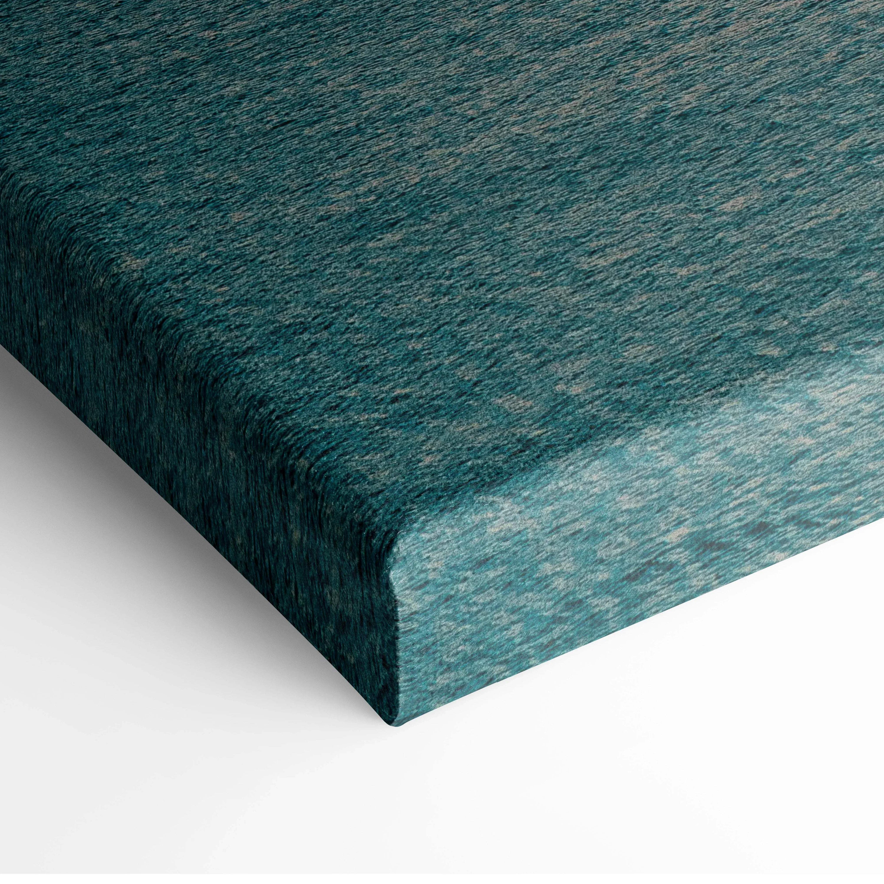 Tranquil ocean sunset canvas wall art with textured teal and blue hues.