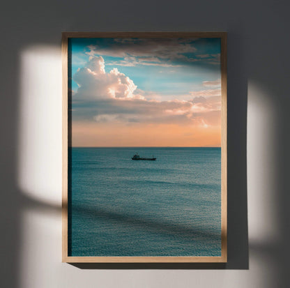Vertical ocean sunset poster with vibrant sky and calm water framed as wall art.