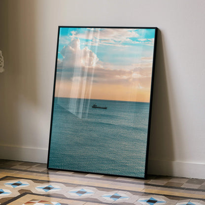 Ocean sunset poster with calm blue waves and a small boat, vertical wall art.