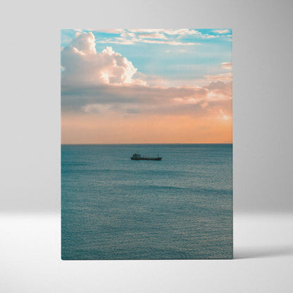 Ocean sunset scene with calm water and cloudscape on vertical canvas wall art.