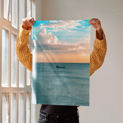 Vertical ocean sunset poster with soft orange sky and calm blue sea wall art.