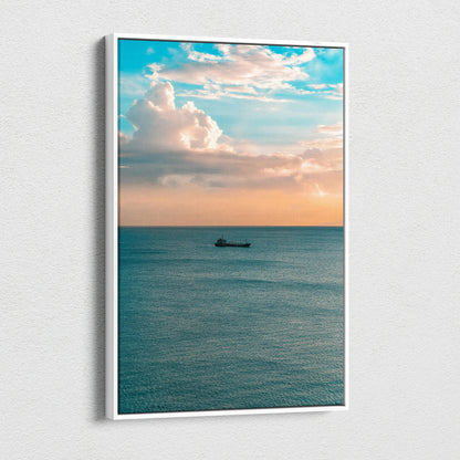 Vertical canvas wall art of calm ocean with boat under a pastel sunset sky.