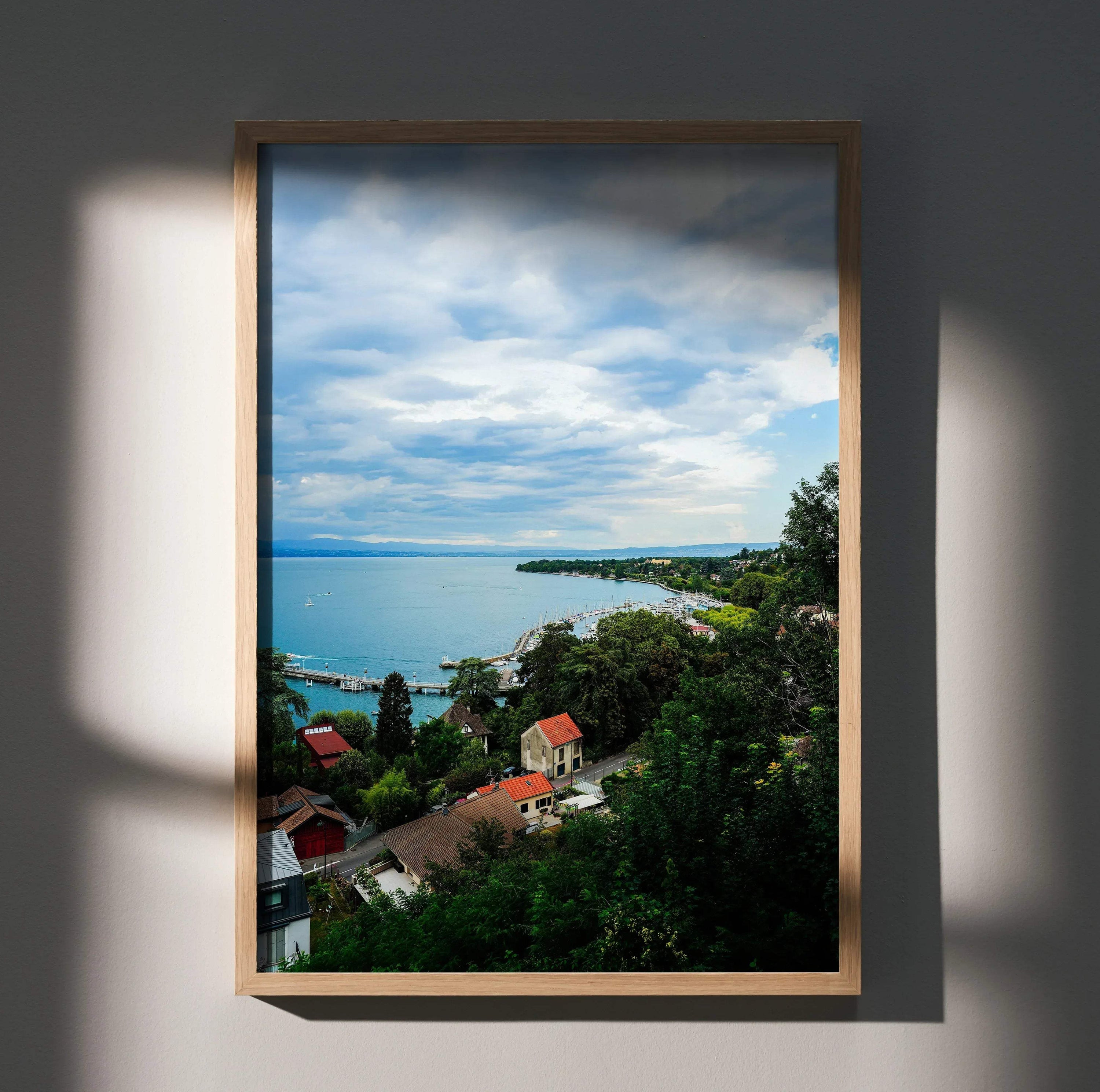 Vertical wall art poster featuring a tranquil nature landscape with blue sky, water, and greenery.