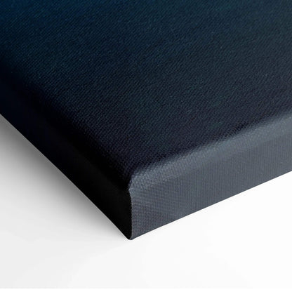 Dark blue wrapped canvas wall art corner showing textured material and neat edges.